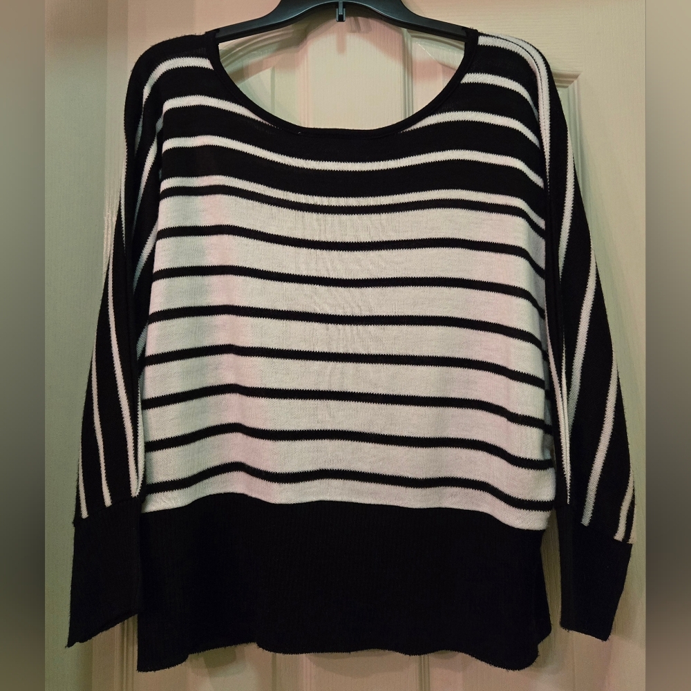 A Knitch Above Black and White Striped Sweater